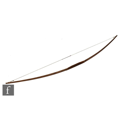 657 - A traditionally constructed ash archer's bow with whipped detail to the grip, length 177cm. Provenan... 