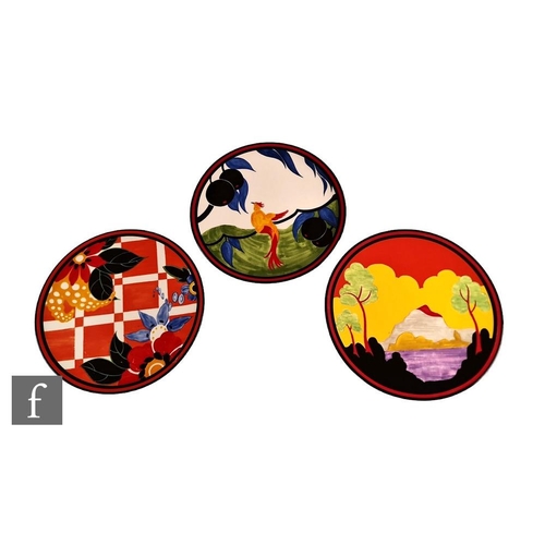 61 - Three Wedgwood Clarice Cliff Bradford Exchange chargers, the first decorated in the Blossom pattern,... 