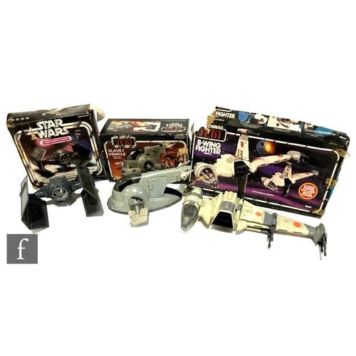 Three vintage Star Wars vehicles with boxes, Darth Vader's TIE Fighter, Slave I and Bwing Fighter.