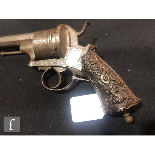 994 - A late 19th to early 20th Century pin fire six shot pistol, engraved with floral decoration, the sto... 