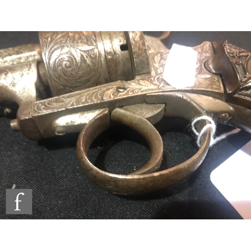 994 - A late 19th to early 20th Century pin fire six shot pistol, engraved with floral decoration, the sto... 