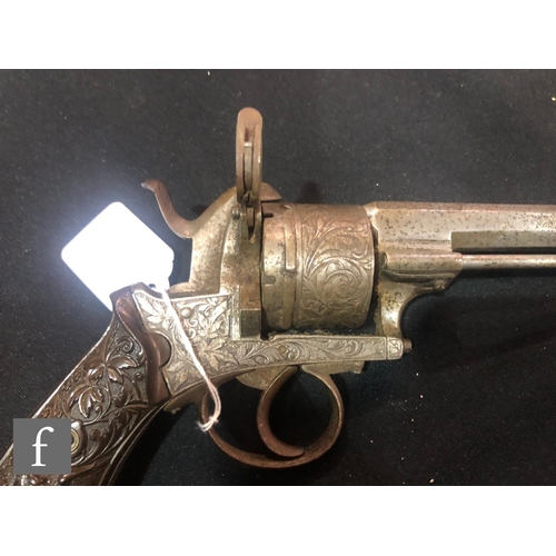 994 - A late 19th to early 20th Century pin fire six shot pistol, engraved with floral decoration, the sto... 