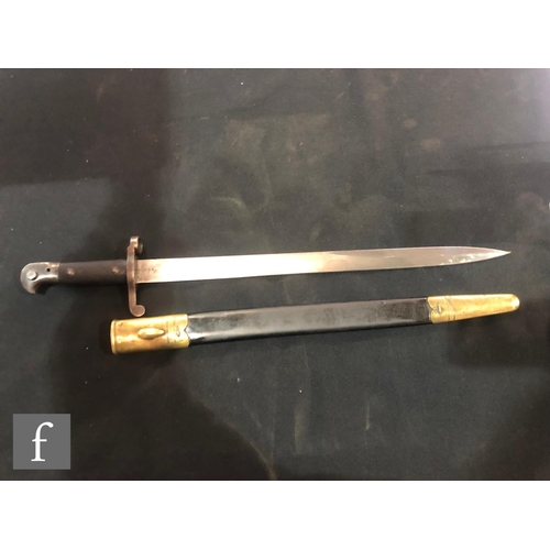 995 - An early 20th Century bayonet stamped Wilkinson Sword Company London, blade 46.5cm, with brass mount... 