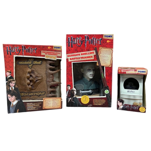 9247 - Three Tomy Harry Potter items, The Monster Book of Monsters Keep Safe Box, Ultimate Duelling Battle ... 