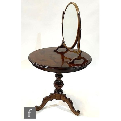 9310 - A Victorian style circular inlaid occasional table on tripod legs, diameter 70cm, and an oval swing ... 