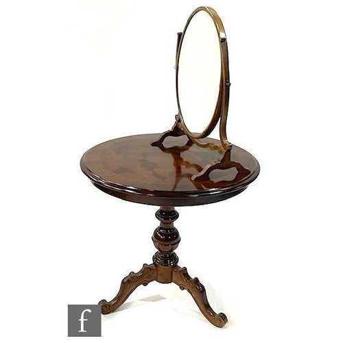 9310 - A Victorian style circular inlaid occasional table on tripod legs, diameter 70cm, and an oval swing ... 