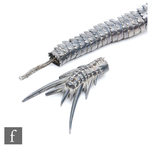 1180 - An early 20th Century white metal study of an articulated Japanese dragon with two claws to each foo... 