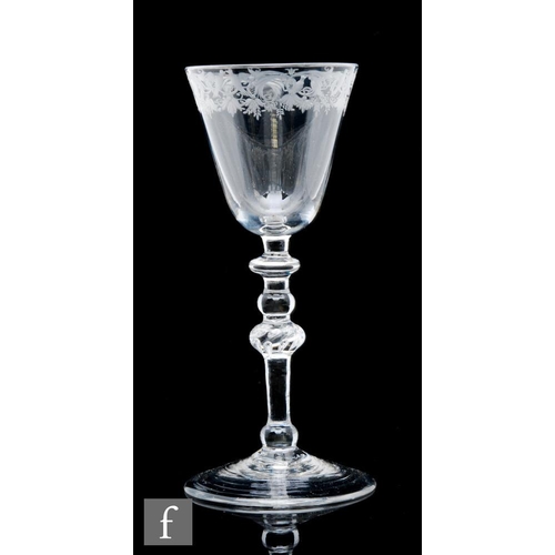 48 - A Newcastle light baluster drinking glass circa 1740, the round funnel bowl engraved to the upper ri... 