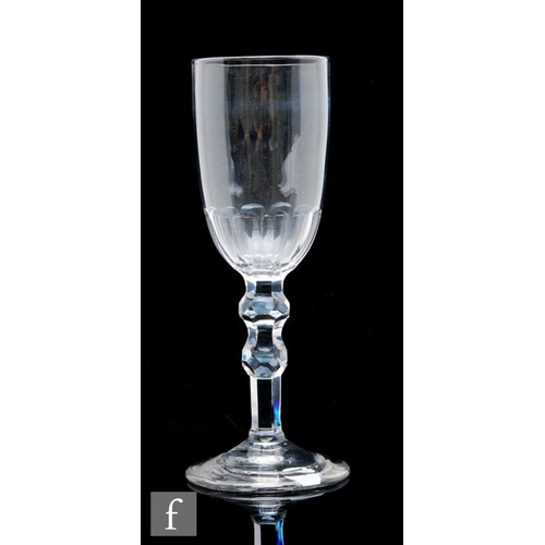 56 - An 18th Century ale glass circa 1820, with funnel bowl with basal petal moulded fluting, over a face... 