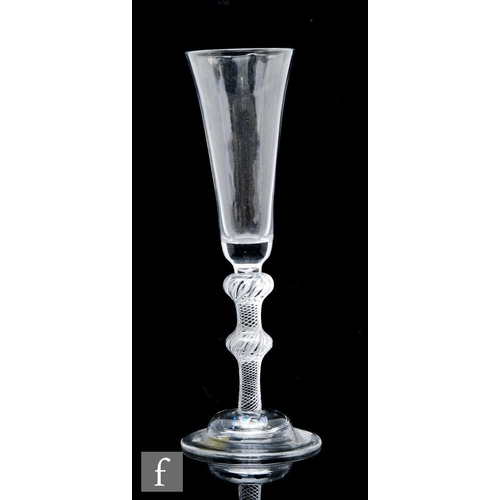 57 - An 18th Century ale glass circa 1755, the trumpet form bowl above a multiple series air twist stem w... 