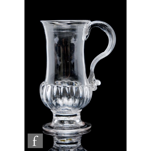 60 - An 18th Century glass tankard, circa 1750-1760, with gadrooned base and spiral ribbing to the top of... 