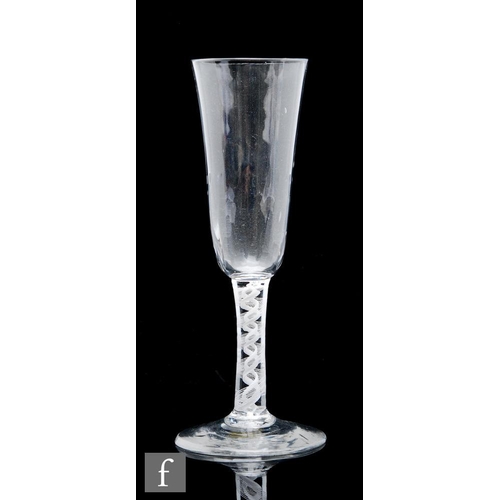 61 - An 18th Century ale glass circa 1765, with elongated round funnel bowl with moulded basal flutes, ab... 