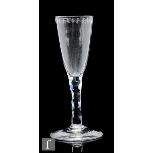 67 - An 18th Century ale glass circa 1780, the round funnel bowl with an engraved OXO border, over a hexa... 