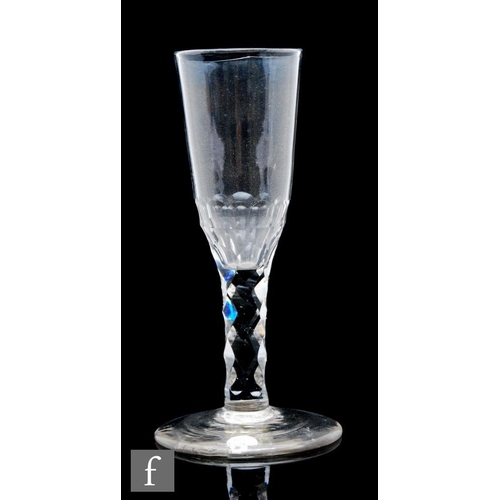 69 - An 18th Century ale glass circa 1780, the round funnel bowl above a diamond facet stem, raised to a ... 