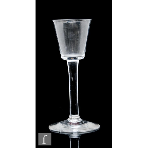 78 - An 18th Century wine glass circa 1730, the bucket bowl over a plain stem and raised to a conical foo... 