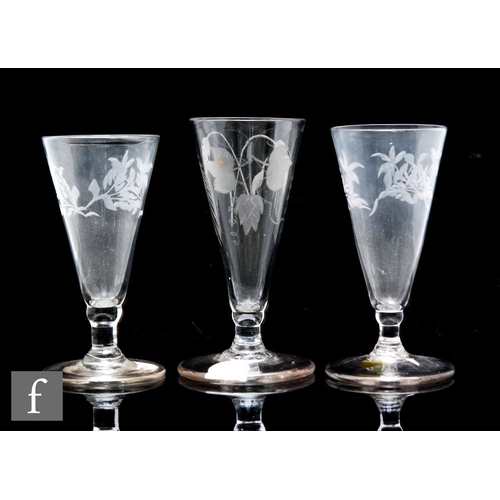 84 - A pair of 18th Century dwarf ale glasses circa 1780, the bowl engraved with flowers above a short te... 