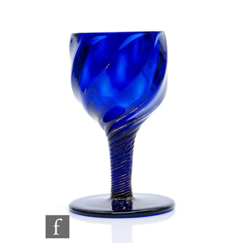 3 - An 18th Century Bristol blue drinking glass circa 1755, the ovoid wrythen fluted ball falling to an ... 