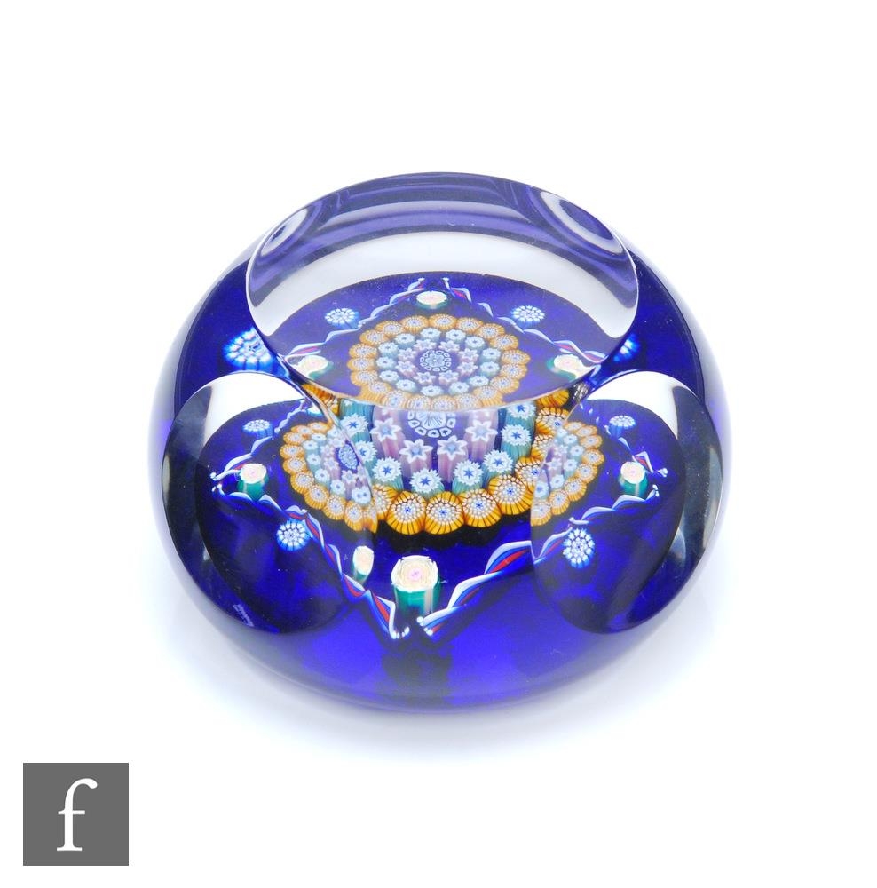 A John Deacons faceted Clichy Square glass paperweight, internally