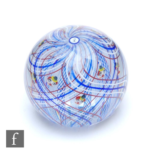 790 - A Twists Glass paperweight in the Clown pattern by Mike Hunter, of domed form internally decorated w... 