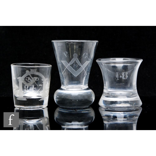 249 - An 18th Century Georgian Masonic firing glass of flared form, engraved with a Masonic emblem above a... 