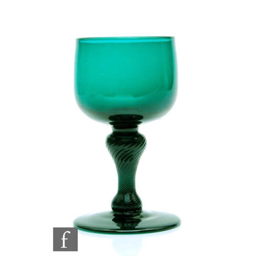 319 - An 18th Century wine glass circa 1780, the ovoid bowl above a baluster incised twist stem, raised to... 