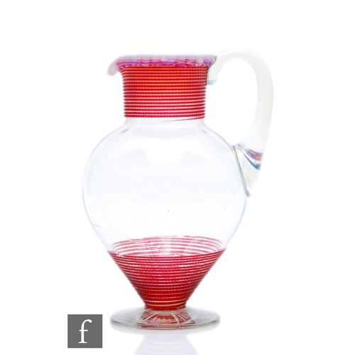 482 - A late 19th Century Stourbridge glass jug, circa 1860, of footed shouldered tapering form with short... 