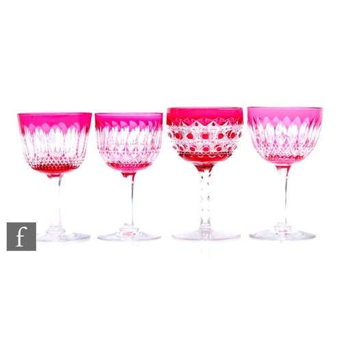 496 - A mixed collection of four late 19th Century Stourbridge wine glasses, each cased in ruby over clear... 