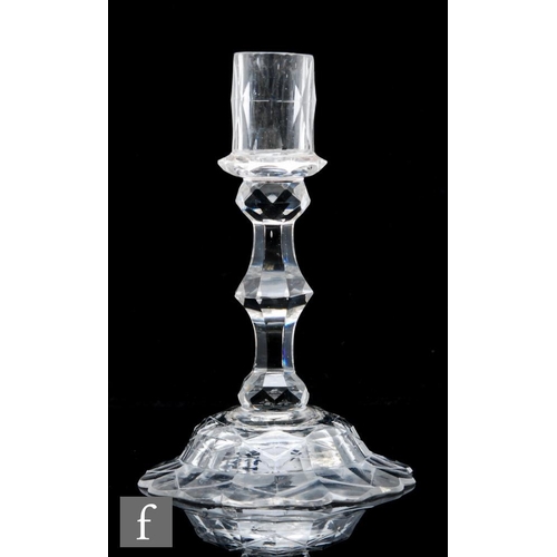 269 - An 18th Century glass candlestick circa 1770, facet cut drip pan and collar, above an eight sided fa... 