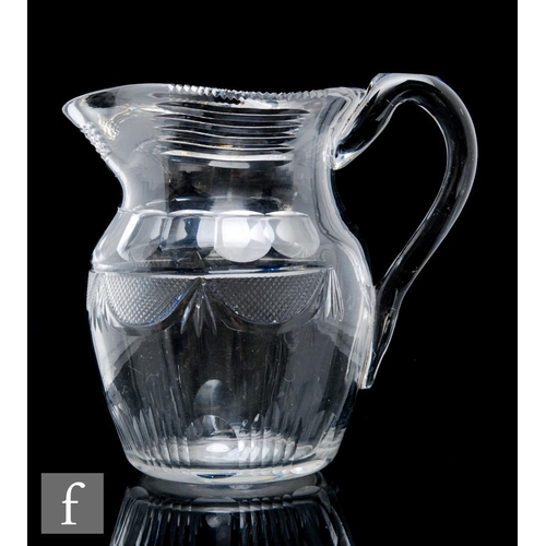 243 - A late Georgian Irish cut crystal glass water jug in the Waterford style, of shouldered ovoid sectio... 