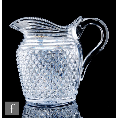 247 - A late Georgian Irish clear cut crystal water jug circa 1810, the shouldered ovoid body heavily cut ... 