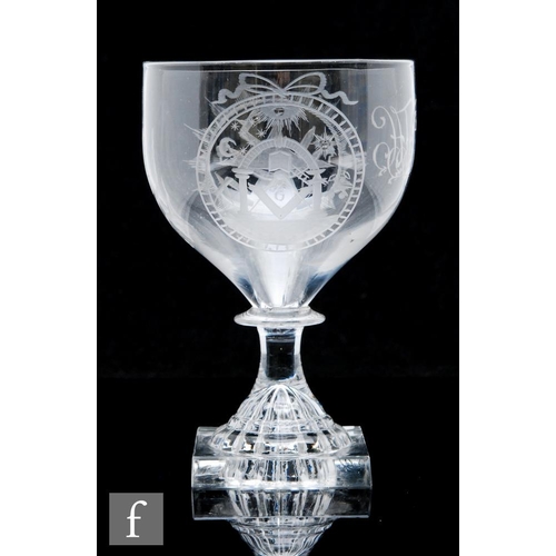 259 - An 18th Century glass rummer circa 1800, the ogee bowl engraved with two cartouche panels of Masonic... 