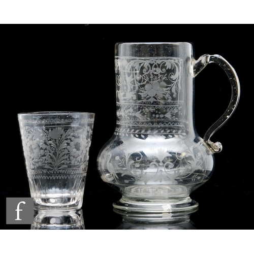 286 - A late 18th Century Bohemian glass jug circa 1800, of footed baluster form engraved with a male figu... 