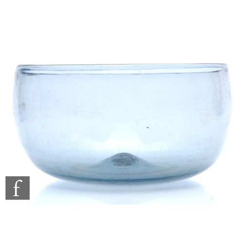 55 - An 18th Century large glass bowl, of high sided circular form, all in a smoky grey ground, diameter ... 