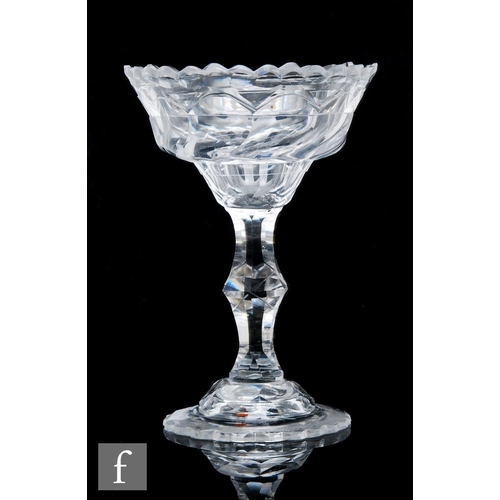 108 - An 18th Century sweetmeat glass circa 1760, the facet cut ogee bowl with notched rim above a facet c... 