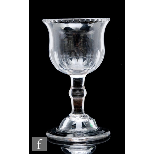 104 - An 18th Century sweetmeat glass circa 1750, large waisted cup bowl with notched rim, above a plain s... 