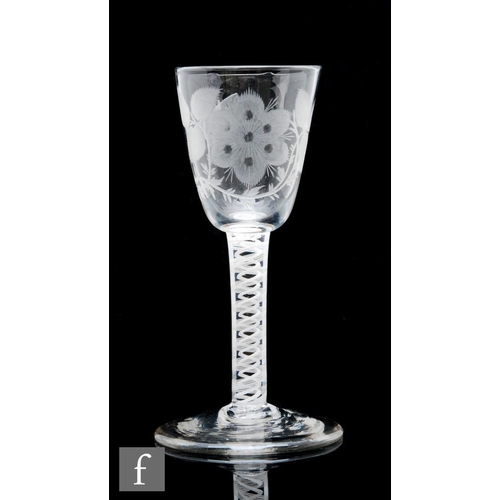 124 - An 18th Century Jacobite drinking glass circa 1765, the round funnel bowl engraved with a rose on bo... 