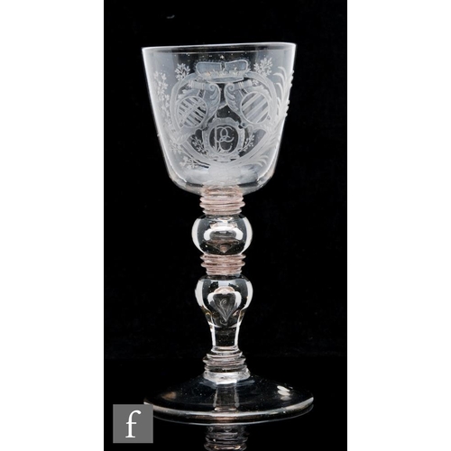 288 - An 18th Century Saxon goblet circa 1730, the round funnel bowl engraved with an armorial with a mark... 