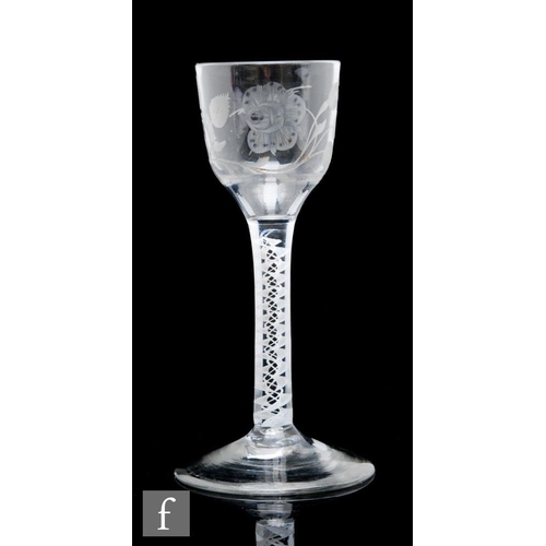 196 - An 18th Century drinking glass circa 1765, the ogee form bowl engraved with a rose and bud on bough ... 