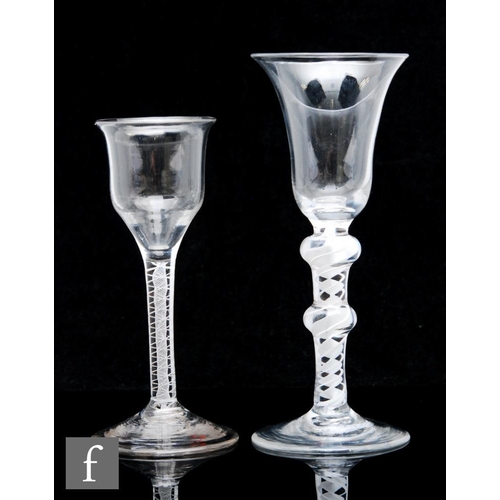 201 - An 18th Century drinking glass, circa 1765, the lipped ogee bowl above a double series opaque twist ... 