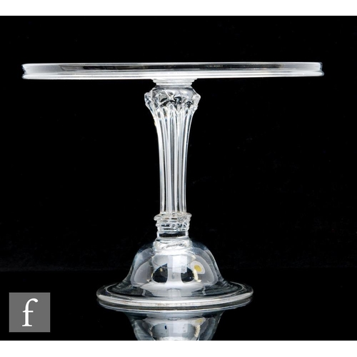 294 - An 18th Century clear crystal tazza circa 1740, with a wide circular top and collar rim, above a hol... 