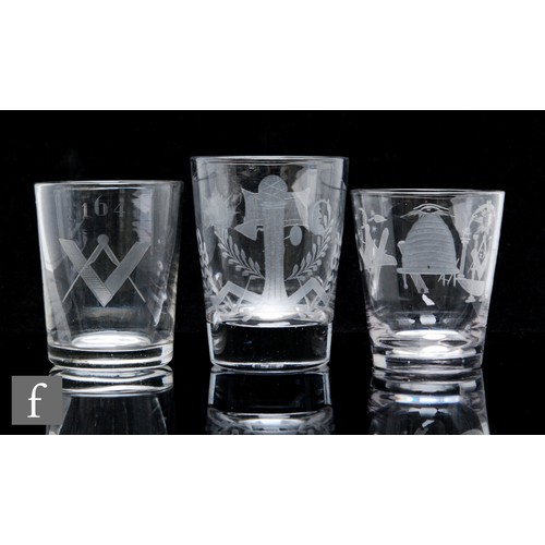 257 - A collection of three tumblers circa 1810, each with firing foot and engraved with Masonic symbols, ... 