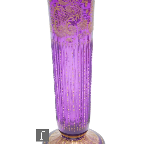 390 - A late 19th Century crystal glass vase attributed to Moser, the sleeve form body with upper rococo s... 