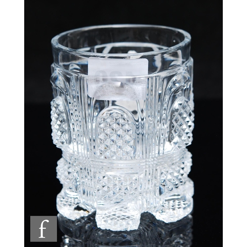 420 - A mid 19th Century French pressed glass tumbler by Baccarat, the cylindrical body high relief moulde... 