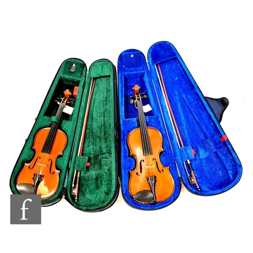 A Stentor student three quarter size violin, together with a