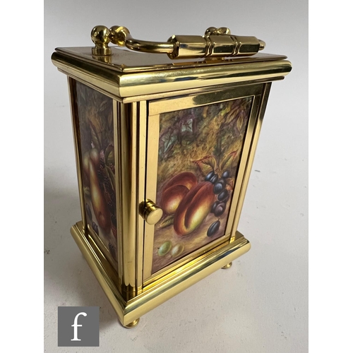 62 - A Kingsley Enamels Fallen Fruits carriage clock decorated to each face with hand painted fruits and ... 