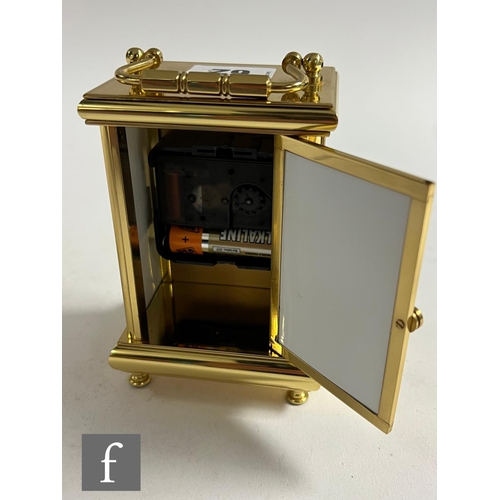 62 - A Kingsley Enamels Fallen Fruits carriage clock decorated to each face with hand painted fruits and ... 