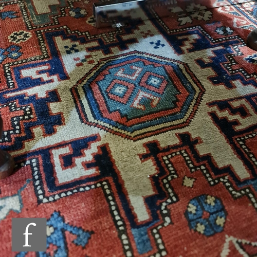 1279 - A Shirvan flat woven rug of deep blue, rust and oatmeal ground colours, with triple medallions to th... 