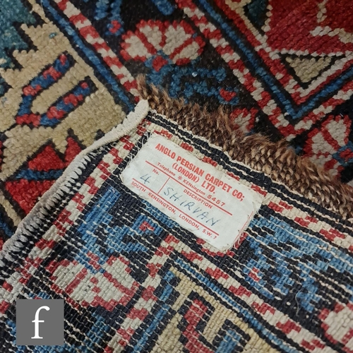 1279 - A Shirvan flat woven rug of deep blue, rust and oatmeal ground colours, with triple medallions to th... 