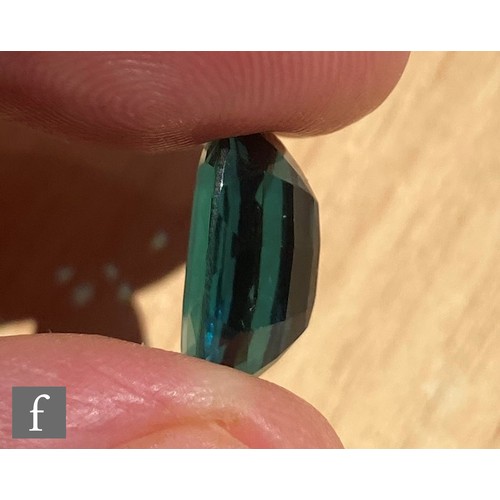 102 - A loose cut and polished oval mixed cut natural indicolite tourmaline stone, length 13.82mm, width 9... 