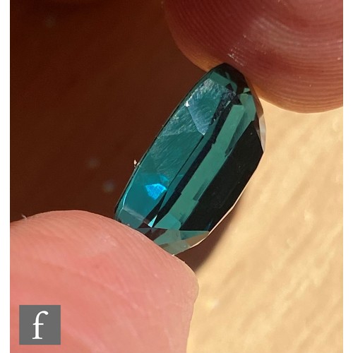 102 - A loose cut and polished oval mixed cut natural indicolite tourmaline stone, length 13.82mm, width 9... 